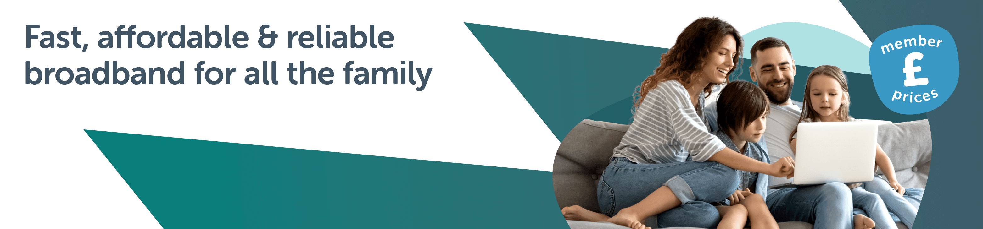 Family sat on sofa looking at a laptop