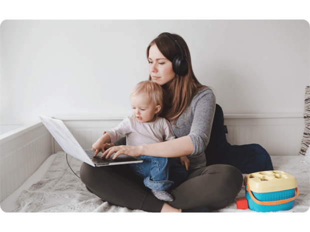 woman and child using a laptop