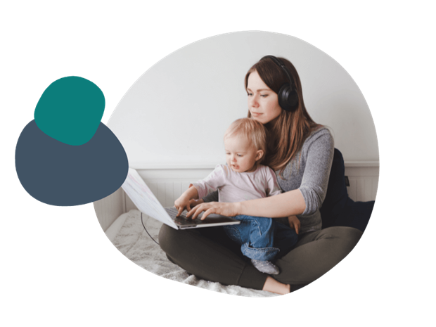 Young mother using her laptop with a child