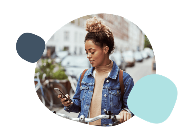 woman using her phone on a bike