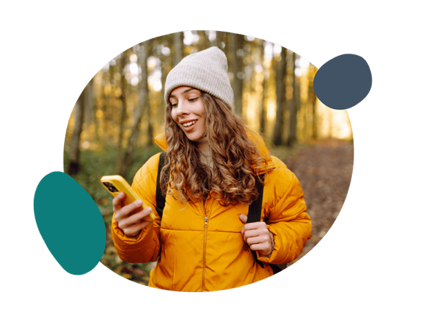 woman using her mobile in the woods