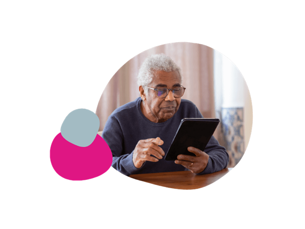 elderly man using his tablet