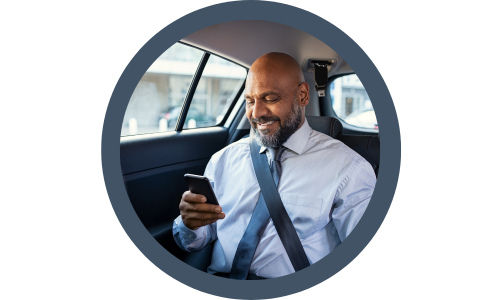 businessman using his phone in a taxi