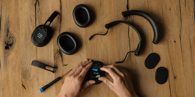 person building Fairbuds XL headphones