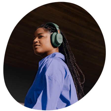 woman wearing green fairbuds xl headphones