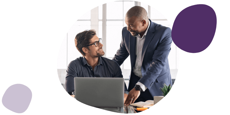 manager helping a colleague with work