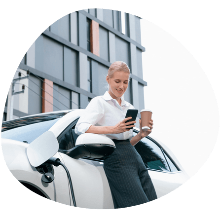 business woman charging her EV car