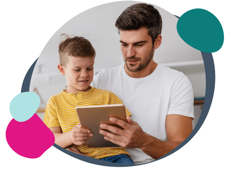 father and son using a tablet