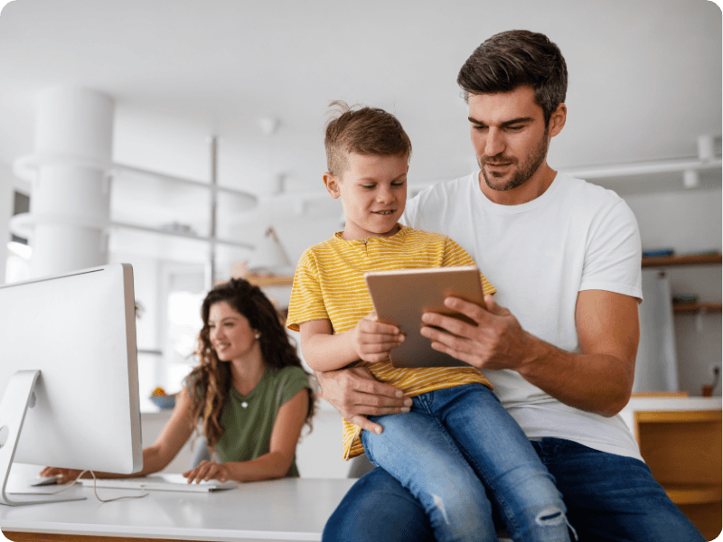 father and son using a tablet