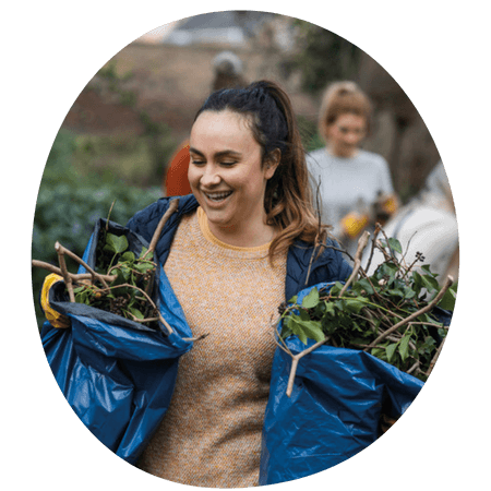 young volunteering doing garden work