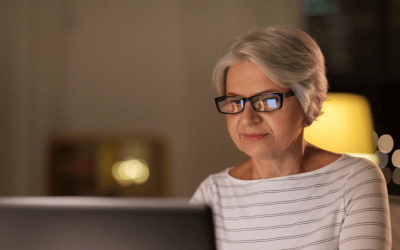 elderly woman using her computer