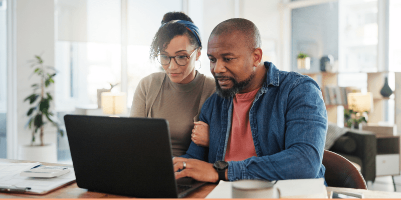 couple using their computer learning about the Big Switch Off