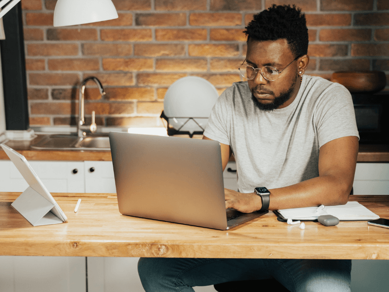 man using his laptop at home