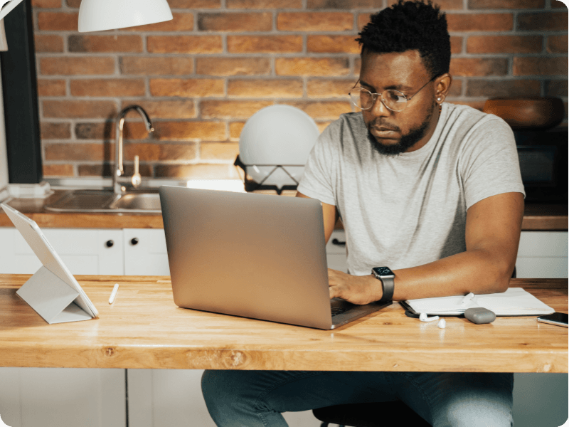 man using his laptop at home