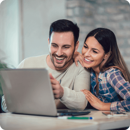 young couple using their laptop 
