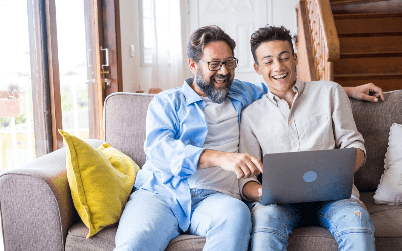 Father & Son using a laptop together