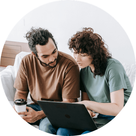 young couple checking their computer