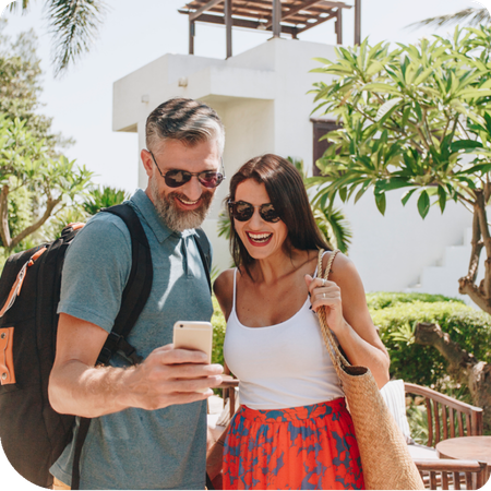 couple using their phone on holiday