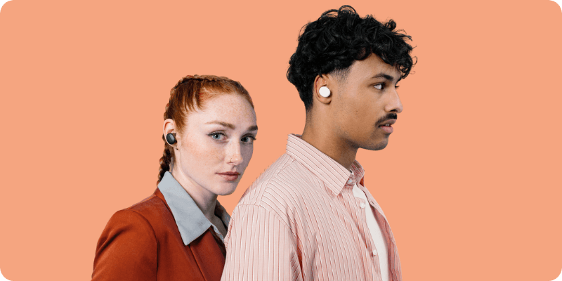 two friends wearing their fairbuds in black and white