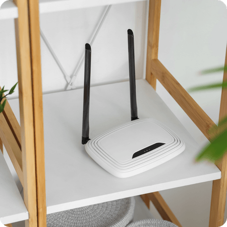broadband router on a shelf