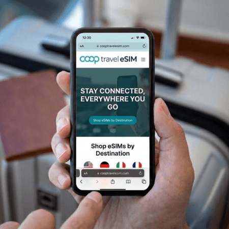 person using the coop travel esim app on their phone