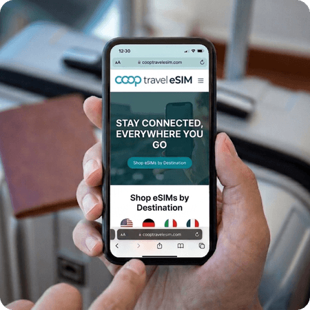 person using the coop travel esim app on their phone