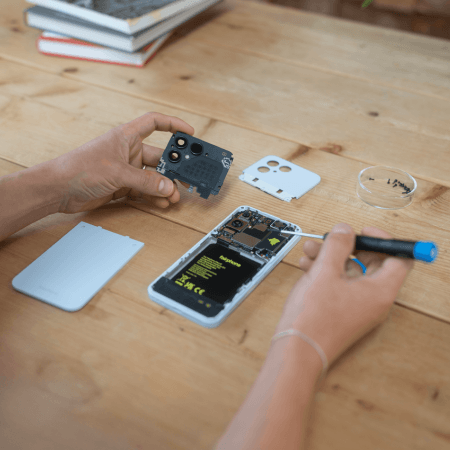 person repairing their fairphone gen. 6