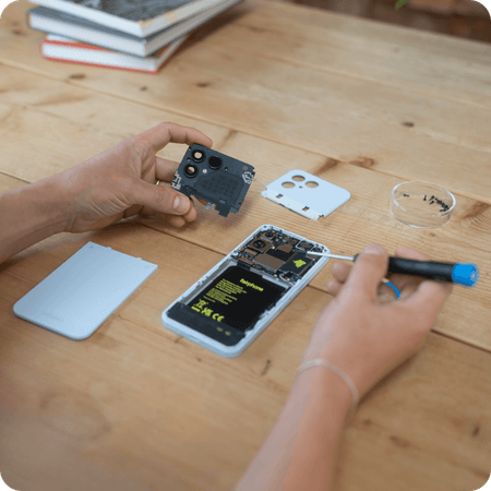 person repairing their fairphone gen. 6