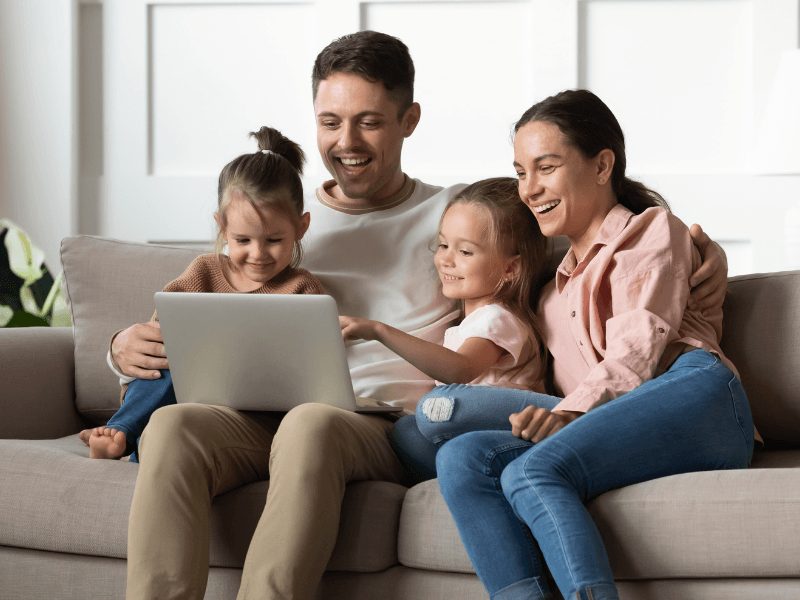 young family using their laptop