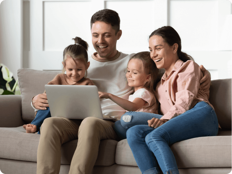 young family using their laptop