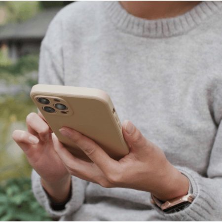 woman texting on her phone outside