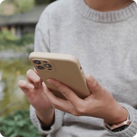 woman texting on her phone outside
