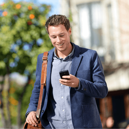 Man using his phone on the way to work