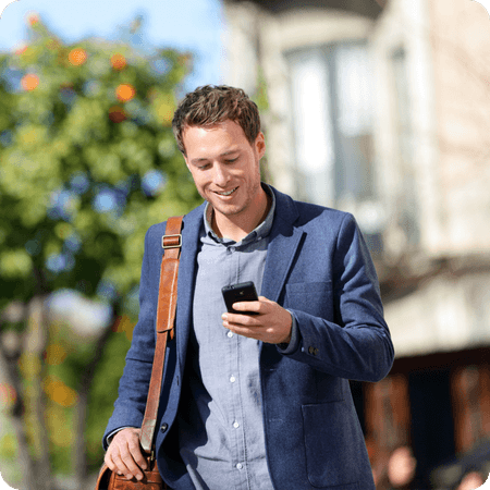 Man using his phone on the way to work