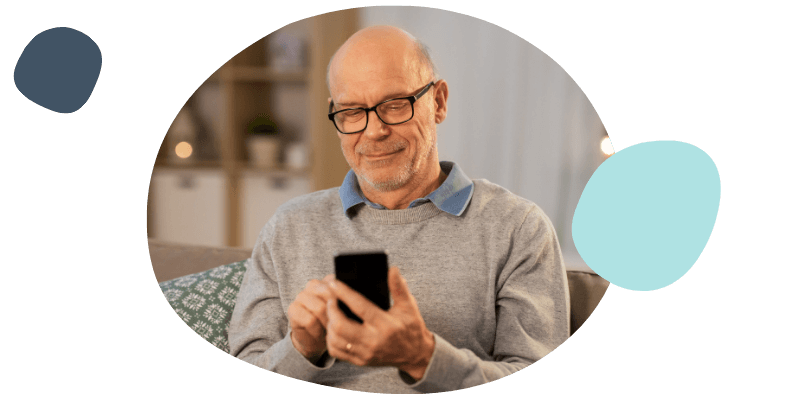 elderly man using his phone