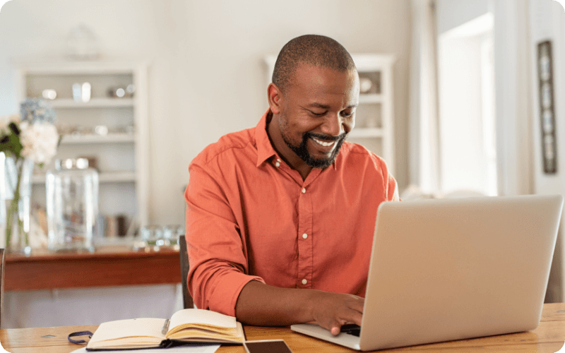 Man searching his computer for broadband