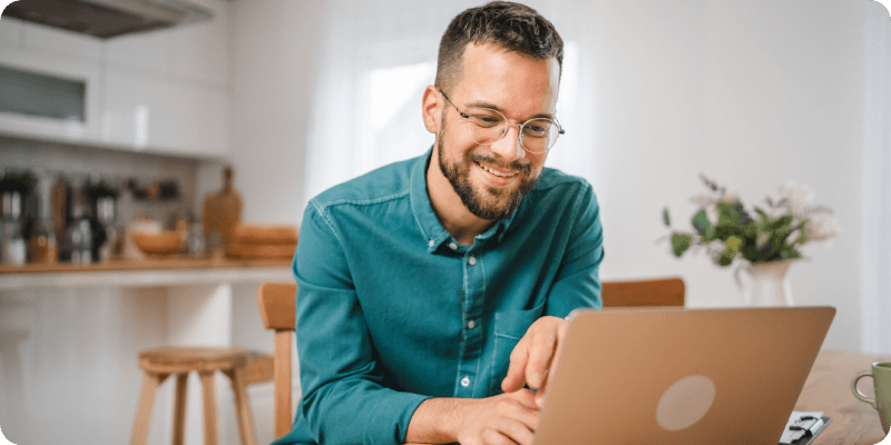 man using his laptop to check WPS settings