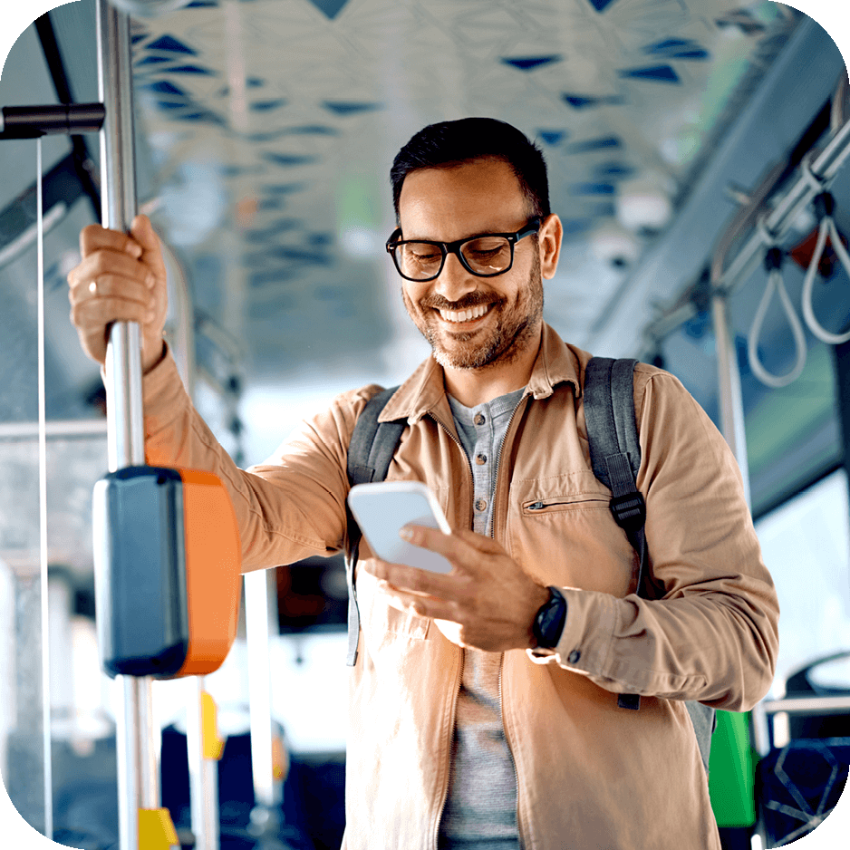 man checking his mobile on the bus