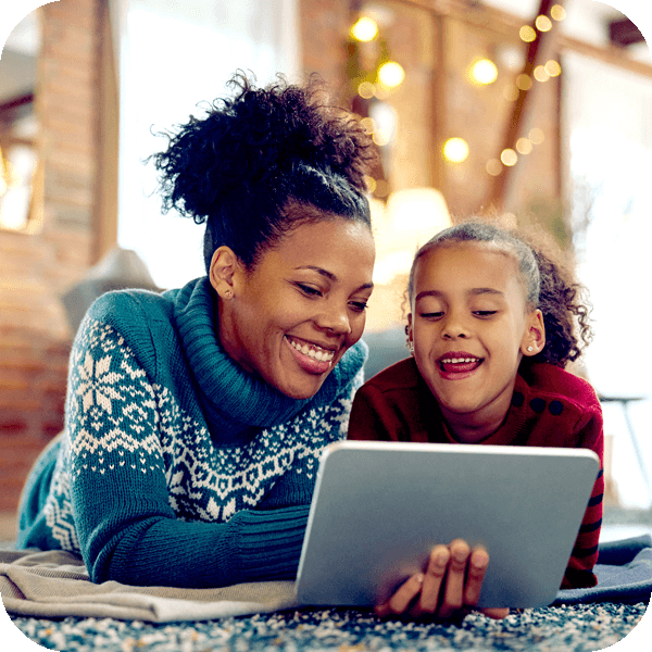 women and daughter using their tablet