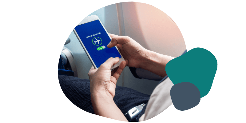 person turning airplane mode on their mobile