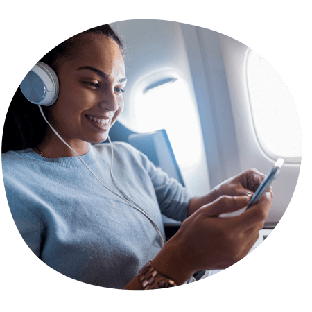 woman watching a video on a plane