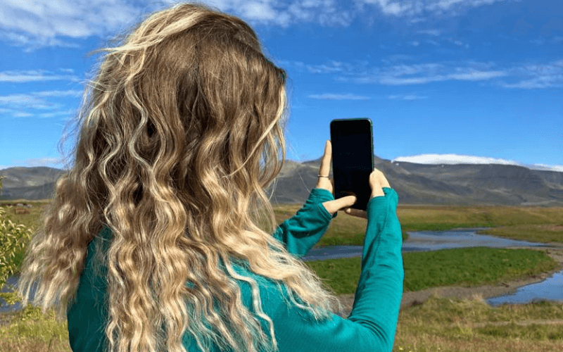 woman using phone to take a photo