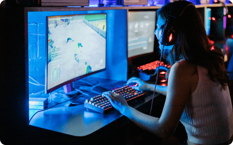 Young woman playing a computer game