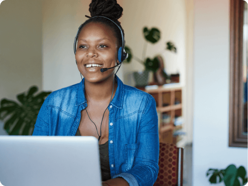 woman taking a phone call on her computer