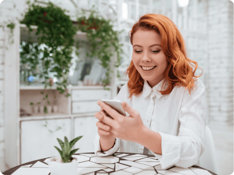 woman checking her mobile at home
