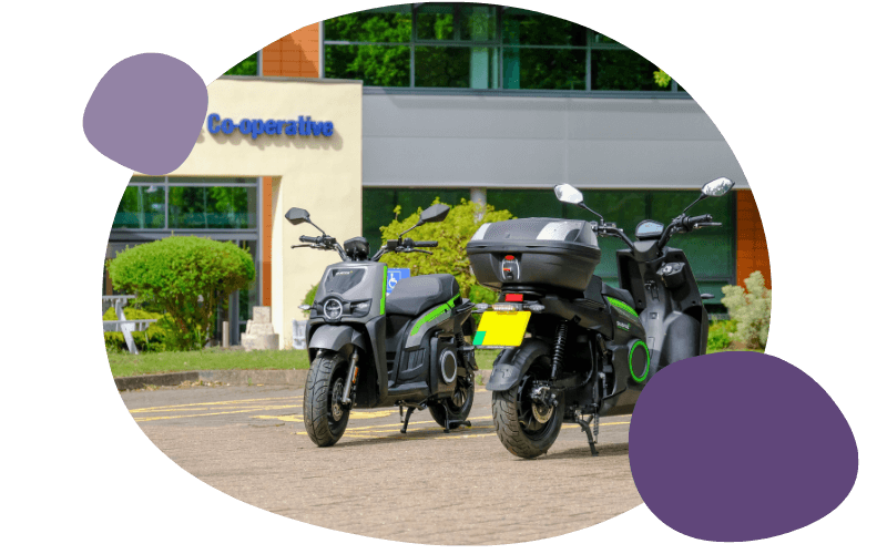 two mopeds outside Midcounties Co-operative office