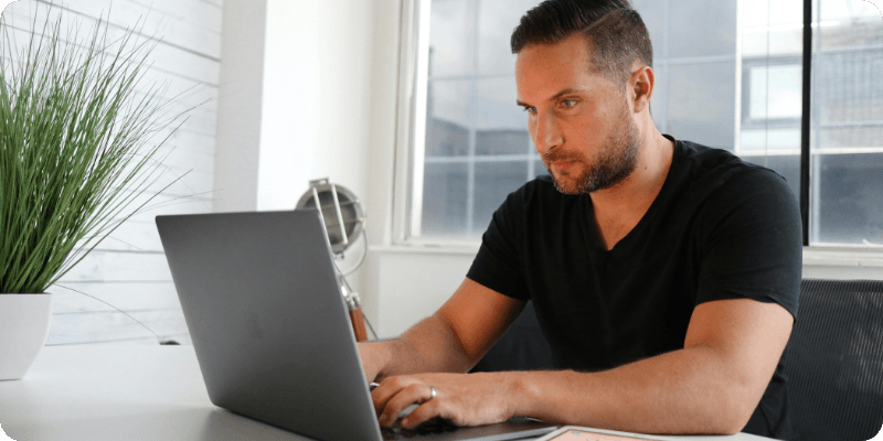 man using her computer 