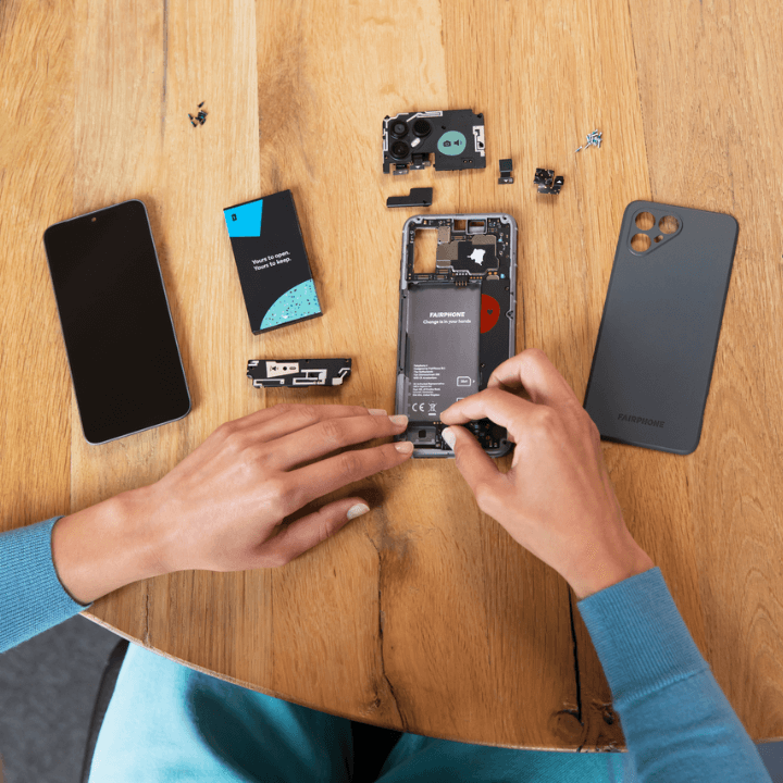 person repairing a Fairphone 4 mobile