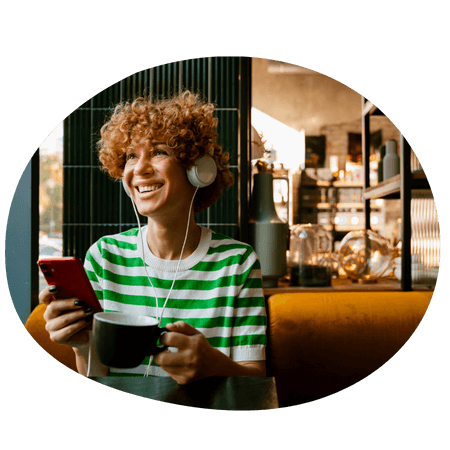 woman listening to music at a coffee shop