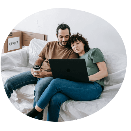 young couple using a laptop together